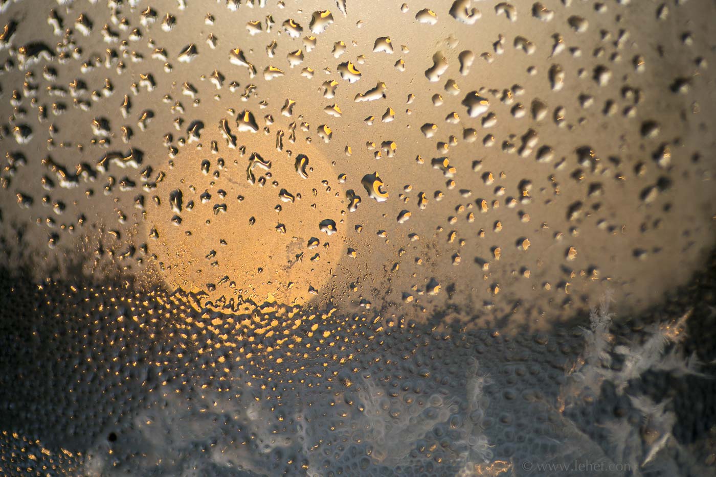 Winter Sunrise Through Ice Window